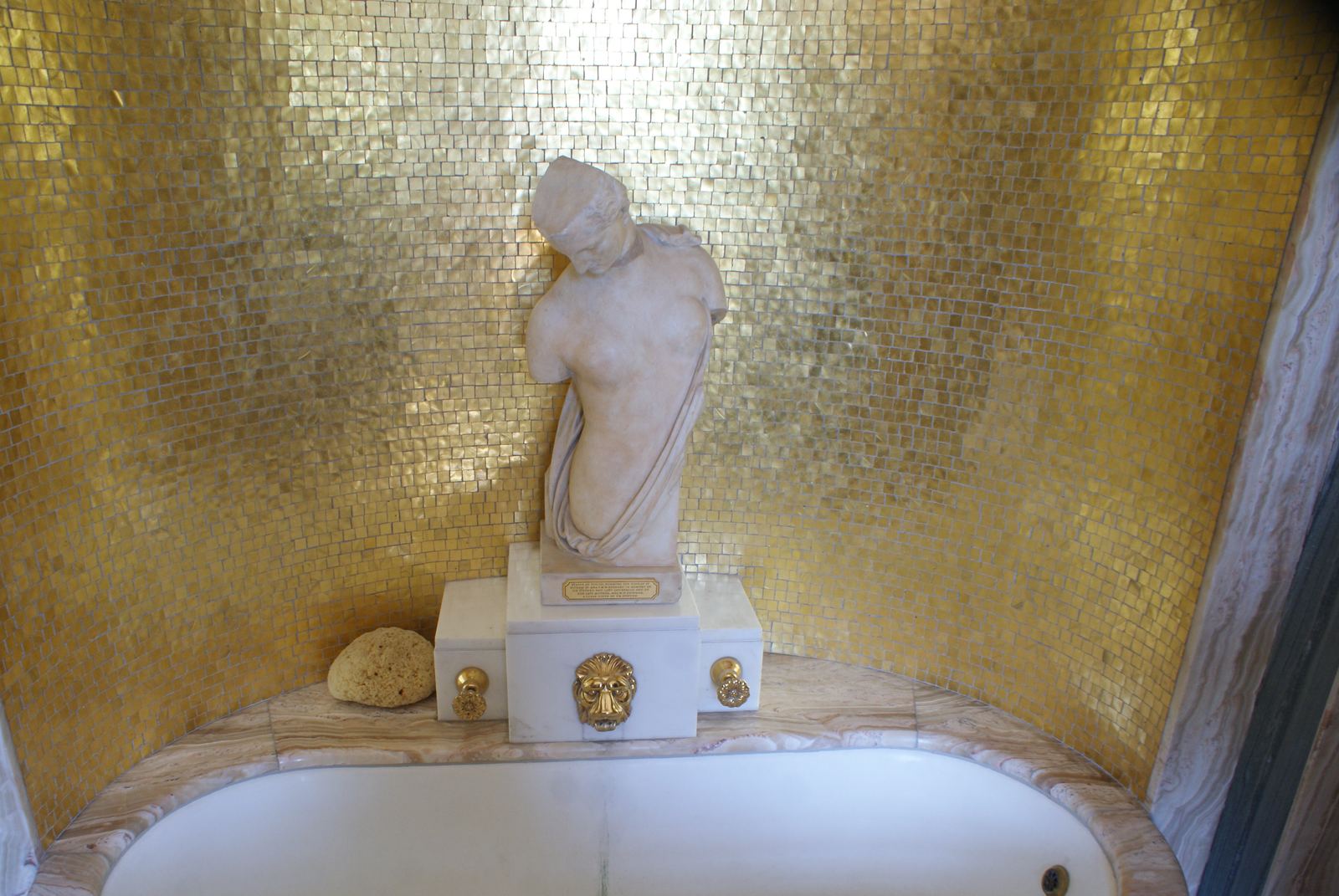Grand marble bathroom with gilded fittings
